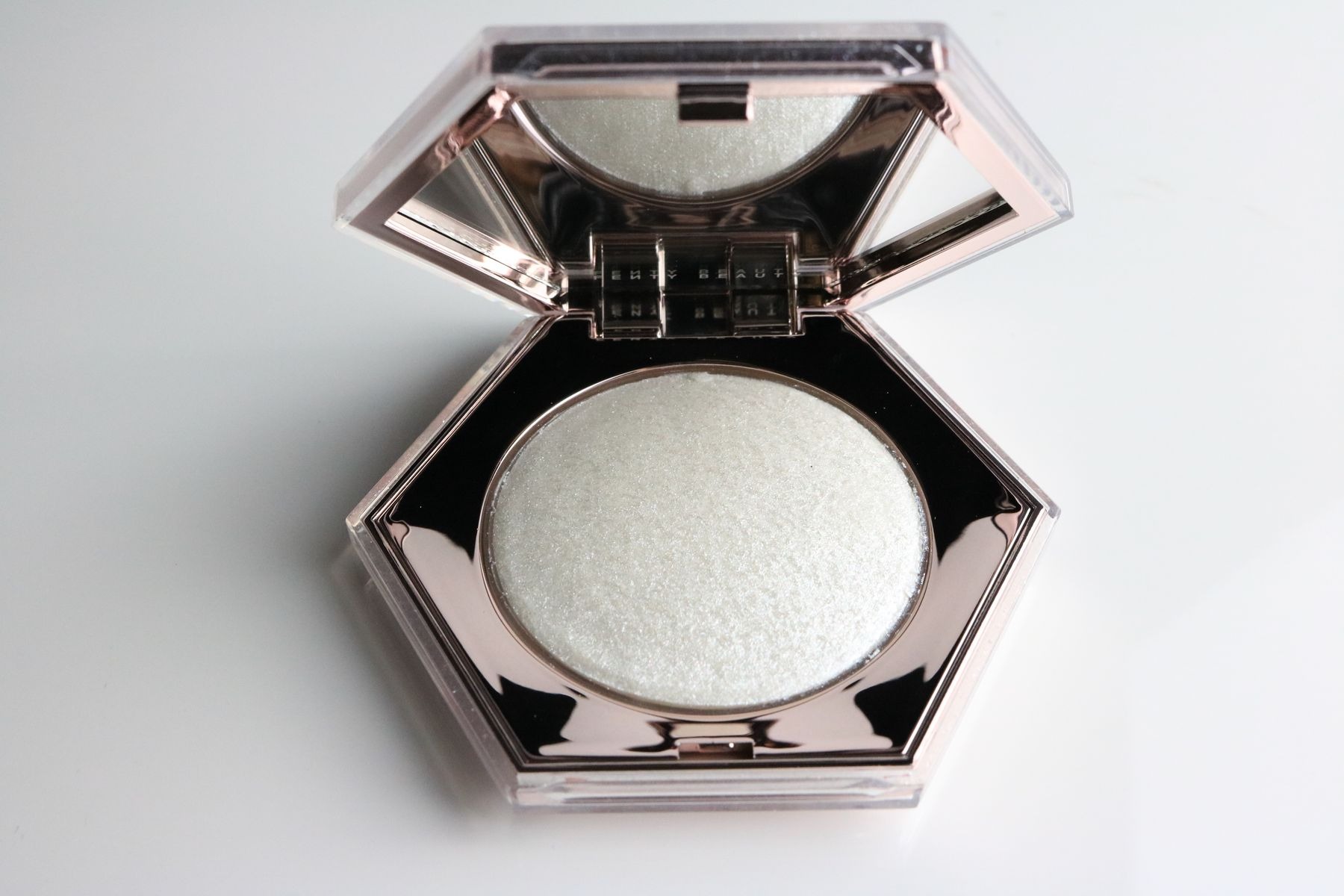 Close-up of a makeup highlighter compact